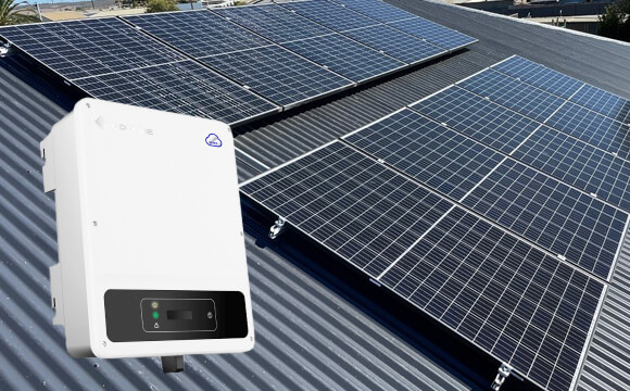 Solar inverter mounted beside rooftop solar panels